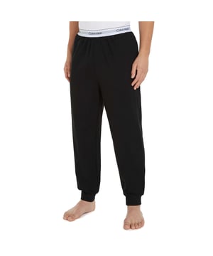 Mens Calvin Klein Lounge Joggers in black.- Branded elasticated waistband.- Side seam pockets.- Rib-knit cuffs.- Regular fit.- Ref: 000NM2302EUB1