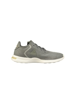 Introducing the Le Coq Sportif Solas 2 Tones Men's Grey Trainers – a harmonious blend of minimalist aesthetics and sporty functionality. These trainers embody Le Coq Sportif's dedication to creating footwear that seamlessly fuses style and performance. With a sleek two-tone design and advanced features, the Solas 2 Tones Grey Trainers are your ticket to elevated comfort and versatile fashion.

Key Features: 

 Modern Elegance:  The Solas 2 Tones Grey Trainers exhibit a modern and streamlined design, making them an ideal addition to your everyday wardrobe. The two-tone grey color scheme exudes understated sophistication, allowing you to effortlessly pair them with various outfits.

 Lightweight Construction:  Crafted with lightweight materials, these trainers ensure that you experience minimal foot fatigue during prolonged wear. Whether you're on a leisurely stroll or engaging in light activities, the lightweight design contributes to your overall comfort.

 Responsive Cushioning:  The trainers incorporate responsive cushioning technology in the midsole, providing an optimal balance of support and shock absorption. This feature enhances your walking and jogging experiences by minimizing the impact on your joints.

 Breathable Upper:  The upper of the Solas 2 Tones Trainers features a combination of breathable mesh and synthetic overlays. This design promotes proper ventilation, preventing excess heat and moisture buildup for a comfortable and dry feel.

 Iconic Logo:  Le Coq Sportif's signature rooster logo is tastefully displayed on the trainers, representing the brand's commitment to quality and authenticity. The logo adds a touch of recognition to the overall design.

 Secure Fit:  The lace-up closure system ensures a secure and adjustable fit, allowing you to tailor the trainers to your specific comfort level.