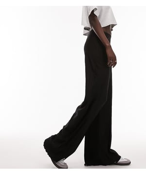 Trousers & Leggings by Topshop Tall Welcome to the next phase of Topshop High rise Elasticated waistband Wide legSold By: Asos