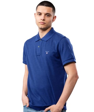 These Original Mens Designer Short Sleeve Gant Polos feature the brands Logo, and a Button-Down Collared Neckline. Crafted With 100% Cotton, these Lightweight and breathable Regular Fit Polos are Suitable for Casual or Workwear.