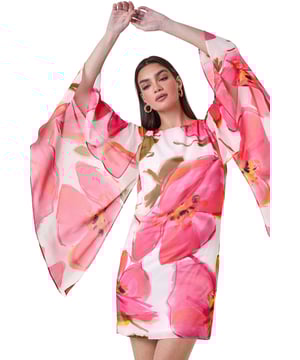Floral Print Chiffon Cape Shift Dress from Roman. Make a statement this season in our elegant, Ariella collection chiffon cape dress. This stunning piece is perfect for those special events with its modest round neckline and secure zip fastening. The whimsical cape sleeves add a touch of drama to the classic shift shape, while the beautiful floral print exudes femininity. The draped chiffon fabric floats gracefully as you move, making you feel like a true belle of the ball! Whether you're attending a wedding or a formal dinner, style with strappy heels and a clutch bag for a look that's sure to turn heads!