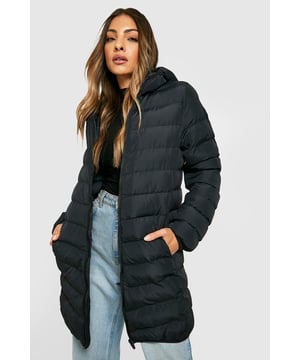 Cosy hooded design for extra warmth and style
        Quilted puffer construction for optimal insulation
        Longline silhouette offers extended coverage
        Practical side pockets for essentials
        Versatile mid-thigh length suitable for various outfits
    
    Embrace the chilly weather with this trendy hooded puffer jacket from Boohoo. Perfect for the fashion-forward woman who doesn't compromise on comfort, this longline coat is a must-have for your winter wardrobe. The quilted design not only keeps you snug but also adds a chic texture to your ensemble. Style it effortlessly with your favourite jeans and trainers for a casual day out, or throw it over a jumper dress and boots for a cosy yet put-together look. Ideal for everything from running errands to meeting friends for coffee, this versatile piece will quickly become your go-to outerwear. The practical side pockets are perfect for keeping your hands warm or stashing your phone and keys. Whether you're heading to a family gathering or a casual night out, this puffer jacket will keep you looking stylish while battling the elements.