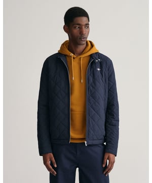 Crafted in a diamond quilting structure, this Quilted Windcheater Jacket features recycled polyester padding and is treated with a water-repellent finish. Design details include a one-way zipper at the front, snap buttons at the collar, slanted welt side pockets and an elasticated hem and cuff with a press button adjuster.
Regular fit  Above hip length  Diamond quilting  Water-repellent
&nbsp;
Shell - Polyester 100%Lining - Polyester 100%Padding - Recycled Polyester 100%
&nbsp;
7006340
&nbsp;