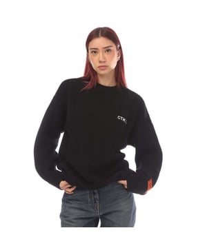 Womens Heron Preston CTNMB Knitted Oversized Crewneck Sweater in black - white.- Ribbed crew neck.- Ribbed cuffs and hem.- Small orange woven brand patch to the left sleeve.- Embroidered logo.- Knitted.- 100% Virgin Wool.- Ref: HWHE013F211001