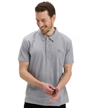 These Original Mens Designer Short Sleeve Gant Polos feature the brands Logo, a Contrasting Trim and a Button-Down Collared Neckline. Crafted With 100% Cotton, these Lightweight and breathable Regular Fit Polos are Suitable for Casual or Workwear.