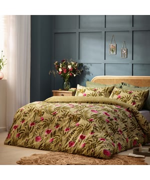 A vivid burst of happiness, our House of Bloom bedding is adorned with striking pink poppies amongst leafy green motifs and marks. Printed and on a soft cotton rich fabric with a textured slub finish, for a relaxed finish and comfort. The reverse features a tonal cotton rich percale, for added comfort whilst you sleep.