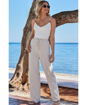 You won't want to take them offCrafted from light and airy linen fabricBreezy wide-leg cutElasticated waist for maximum comfortTrending neutral hueTuck in tees, vest tops and linen shirtsInside leg to fit: Short 29 | Regular 31" | Long 33"