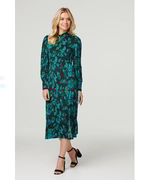 Add a go-to tea dress to your closet with this sleek floral midi. It has a high neck, long sleeves, a cinched waist and a straight midi length skirt with a front split. Made form a comfortable non-iron stretch jersey fabric it's the perfect grab and go ensemble! Pair with neutral heels for a sophisticated and elegant style.