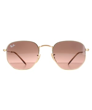 Las gafas de sol Ray-Ban Square unisex hexagonales con gradiente marrón dorado pulido RB3548N son una montura hexagonal muy exclusiva y cuentan con las últimas lentes planas de cristal para una versión actualizada de las clásicas gafas de sol redondas de metal. Las patillas superfinas y el perfil estilizado de la montura completan el moderno look de moda.