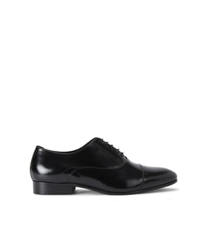 The Josh is a formal Oxford shoe created from a black leather. The front laces up with blind eyelets.
