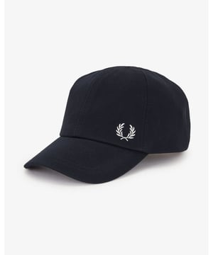 A classic cotton cap inspired by the Fred Perry Shirt.  
Cotton piqué fabric / Internal cotton lining and band / Matte metal adjuster clip / Contrast Laurel Wreath embroidery to the front left side
100% Cotton
HW6726