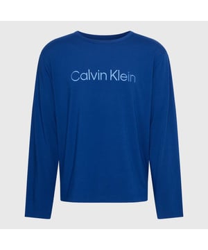 Mens Calvin Klein Long Sleeve Lounge T- Shirt in blue.- Ribbed crewneck.- Long sleeves.- Calvin Klein logo printed on the front of the chest.- Regular fit.- Ref: 000NM2502ECHU