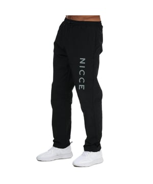 Mens NICCE Mala Track Pants in black.- Elasticated waistband.- Drawstring fastening.- Two side zipped pockets.- Reflective Nicce branding.- Lightweight.- 79% Polyester  21% Cotton. Machine wash at 30 degrees.- Ref: 0952W0050001