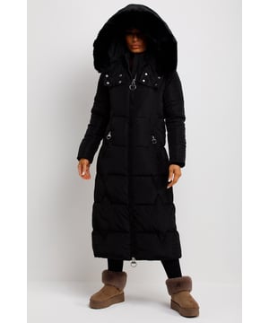Long puffer padded coat with detachable faux fur hood. This long coat is a must have for this new season. Featuring long puffer coat with quilting pattern, extremely warm, weather resistant, zip fastening, pockets and faux fur hood. Style it with our leather look leggings and boots to complete the look. This longline coat is also available in other colours.