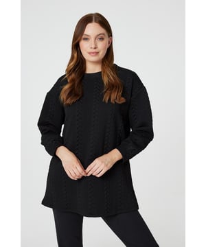 Get cosy in this cable knit oversized jumper. It has a round neck, long sleeves, an oversized longline shape and a thigh length hem. Pair with jeans or leggings for a classic style you can keep in your capsule closet for years to come.