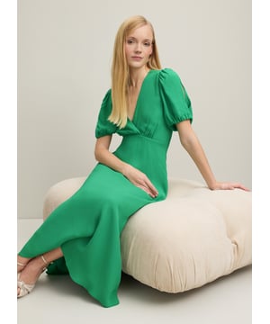 A striking new dress in our Royal Ascot collection, the Hermia dress is in one of our favourite and bestselling colours; a fresh, flattering green. Crafted from lightweight and floaty crepe, it has a deep V-neck and back, puff shoulders, short elasticated sleeves, and a long flippy length. A winner for a day at Ascot or for weddings and parties once the races have been won, team it simply with heels and a clutch.