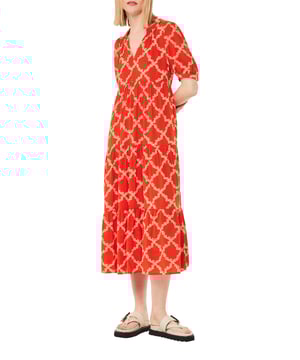 Embrace the day with our Daisy Dress, a charming midi with a vibrant red and multi-pattern design. Perfect for leisurely weekends or casual outings, its flowy silhouette brings comfort with style.