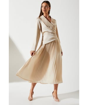 Elegant V-neck design with wrap-style bodice
        Long sleeves for sophisticated coverage
        Fitted waist with subtle ruching detail
        Stunning pleated midi skirt for graceful movement
        Versatile crepe fabric offers comfort and style
    
    Exude timeless elegance in this tailored pleat skirt midi dress from Coast. Perfect for those special occasions that demand a touch of sophistication, this dress combines classic design elements with modern flair. The wrap-style bodice creates a flattering silhouette, while the pleated midi skirt adds a graceful, flowing dimension to your ensemble. Ideal for weddings, the races, or formal gatherings, this dress can be styled to suit a variety of events. Pair with strappy heels and a clutch for a polished look, or add a fascinator for a quintessentially British race day outfit. The versatile crepe fabric ensures comfort throughout your event, while the midi length offers a contemporary twist on traditional occasion wear. This Coast dress is a wardrobe essential for the discerning woman who appreciates quality and style in equal measure.