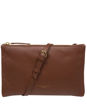 Crafted from high-quality Nappa leather, the 'Anya' cross body bag from Pure Luxuries London's Marylebone Collection is a must-have thanks to the super soft-to-the-touch feel and finish. A stylish zip-over top secures the central compartment which is lined with 100% cotton for a flawless look. Additional storage is provided by three card slots and a slip pocket, perfect for all your essentials. This accessory is adorned with a slim and adjustable strap with a maximum drop length of 65cm and complemented by eye-catching gold-coloured metal fittings and zips which give it an elegant look. The Pure Luxuries logo is embossed for an effortless and sophisticated finishing touch.