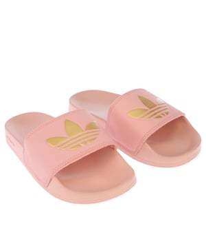 Womens adidas Originals Adilette Lite Slide Sandals in pink.- Slip-on construction.- The inner insole  contoured to the shape of the foot.- Decorated with large gold Trefoil logo on the top.- Rubber outsole.- Synthetic Upper  Synthetic Lining  Synthetic Sole.- Ref.: FW0543