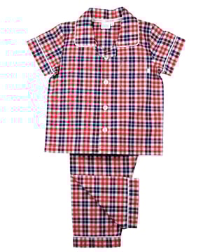 Boys Red Check Traditional Pyjamas

Red and Navy check in a super-soft crisp check create Spring/Summer vibes in our boys’ pyjama set. Made from 100% cotton, the set is trimmed with white cotton. The short-sleeve top has an open collar, a single chest pocket and fastens at the front with engraved buttons. Trousers are fully elasticated at the waist for a comfy fit!

Sold as a Pyjama set.
Fabric: 100% cotton - crisp summer weight.
Fire Warning : KEEP AWAY FROM FIRE AND FLAMES.
Wash Care Instructions : Machine wash inside out, do not soak, wash dark                    colours separately, do not iron trims. Save energy and wash at 30 degrees.
Do not tumble dry