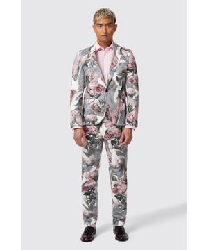 The Dali floral suit jacket was designed to make sure you stand out in the crowd. Cut from a lightweight cotton blend, it's the perfect piece for summer occasions here or abroad when paired with the matching skinny fit trousers. The jacket features a single button closure, shawl lapel, jet pockets and kissing buttons on the sleeves.