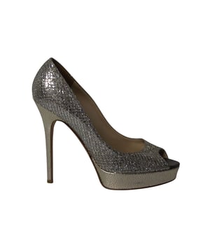 VINTAGE, RRP AS NEW
It is easy to fall in love with these pumps by Jimmy Choo! They've been beautifully crafted from gold glitter fabric and designed with peep toes, platforms and 11.5 cm heels. The pumps are sure to complement all your dresses and evening gowns.

Jimmy Choo Dahlia Platform Peep Toe Pumps in Silver Glitter
Color: silver
Size: EU38.5
Material: Glitter
Condition: very good
Sign of wear: No
SKU: 207248
