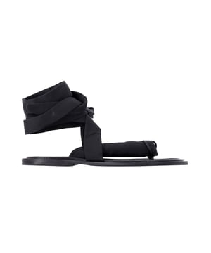 VINTAGE, RRP AS NEW
A versatile, summer-ready piece, these puffy thong sandals have padded straps that combine comfort and style with ankle wraps that ensure a secure fit. The classic black can be worn with white denim to bring out the edgy contrast, or matched with shorts and an oversized tee for the ultimate in casual cool.

Ganni Puffy Wrap Sandals in Black Canvas
Condition: Good with dust bag
Sign of wear: Moderate wear on the soles and insoles, creasing on the insoles, stains on the straps
Material: Canvas
Color: Black
Size: EU38 / UK5 / US8
SKU: 337976