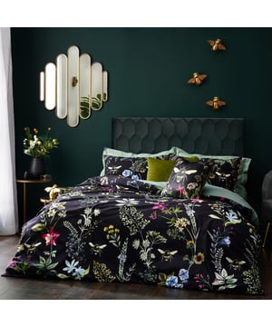 A striking digitally printed duvet set featuring an eye-catching contrast design, which will brighten up your bedroom in an instant, Busy bees hover among the bright, fresh florals of a meadow or garden, which are set on a contrasting luxuriously soft velvet jet black background. This exquisite set adds lovely pops of colour to your bedroom and gives it a natural feel too, helping you wake up in the morning and feel refreshed.