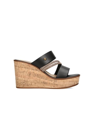 The Kurt Geiger Strand Wedge heel feature a black white upper in leather with gold crystal straps across the foot.  Heel height: 9.5cm.