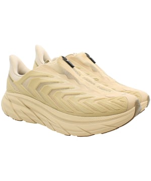 Hoka Project Clifton Men's Trainers, the epitome of innovation and performance in footwear. Crafted with meticulous attention to detail, these trainers are designed to elevate your running experience to new heights. Here's a comprehensive description highlighting their key features:

 Responsive Cushioning:  The Clifton trainers are renowned for their plush cushioning, providing a responsive and comfortable ride with every stride. Utilizing Hoka's signature midsole technology, these trainers offer superior shock absorption to reduce impact on your joints, allowing for longer, more comfortable runs.

 Lightweight Construction:  Engineered with lightweight materials, these trainers offer a feather-light feel without compromising on durability. The breathable mesh upper enhances airflow, keeping your feet cool and comfortable even during intense workouts.

 Meta-Rocker Geometry:  Featuring Hoka's Meta-Rocker geometry, these trainers promote a smooth transition from heel to toe, encouraging a natural gait cycle and enhancing propulsion. This innovative design ensures a more efficient and effortless running experience.

 Supportive Fit:  The Clifton trainers boast a supportive fit that hugs your foot securely, providing stability and minimizing the risk of injury. The padded collar and tongue offer additional comfort and support, while the traditional lace-up closure allows for a customizable fit.

 Multi-Sport Performance:  While ideal for running, the versatility of these trainers extends to various activities, including gym workouts, cross-training, and everyday wear. Their adaptive design makes them a versatile addition to any athlete's wardrobe.