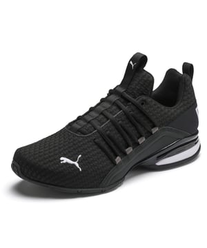 PRODUCT STORY Be bold in the game-changing silhouette of our Axelion Block Running Shoes, which combine contemporary design with the supreme comfort of our foam heel unit for the last word in athletic style. DETAILS   Low boot   Textile upper   Foam heel   TPU shank   Rubber outsole   PUMA Cat Logo at toe
