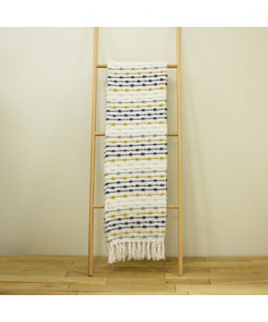 Add texture and warmth to your home, with the chunky Dhadit throw, featuring contrast woven lines in recycled PET yarn and finished with fringed edges.