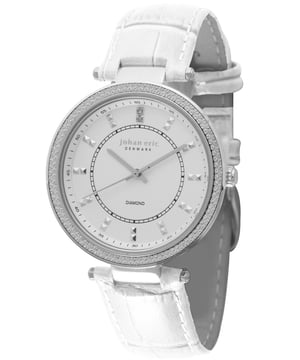 Johan Eric watch from the Ballerup Collection. 37mm round stainless steel case and hardware. Embossed calfskin leather strap with thorn buckle. Diamond-cut bezel resembles diamond pav. White dial with diamond-shaped time markers. Two genuine white diamonds at 12 o'clock. Three-hand Miyota GL30 quartz movement. Scratch resistant mineral crystal window. 0.0024 total diamond carat weight. Water resistant to 3 ATM.