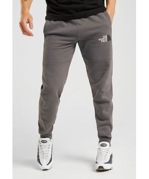 The North Face Mens M COT Pant Grey Joggers. 
Finished with The North Face Branding to the Left Thigh and back of leg.  
Elastic Waist with Drawstring.  
2 Side Hand Pockets.  
Model Is Wearing Size M.