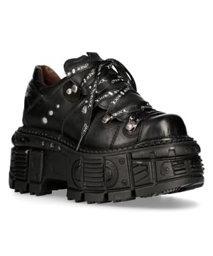 This style of leather ankle boots has become synonymous with the New Rock name and all the quality and style that it is internationally acclaimed for. The iconic New Rock brand shines through on this piece, with the brand name featuring prominently in white text on the laces and a New Rock badge embellished on the heel. For a bold and contemporary edge, the heel and sole are raised to a height of 6cm and 4cm respectively, which gives these boots a standout authority that results in an eye-catching presence. A proud member of the metallic collection this is a great stylish piece that makes for a comfortable wear and exudes a stylish rogue look. • Heel Height - 6cm• Platform Height - 4cm• Shaft Height - 11cm• Black Laces with white branding• Sole Material - PU• Outer Material - Cow Hide Leather