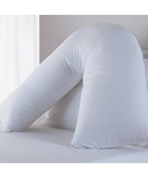 Naturally shaped to support both neck and head this superb V-shaped orthopaedic Pillow is the great value and must have accessory for improving your comfort and sleep. The V-shaped design helps to reduce stiffness of the neck and back by moulding to conform to your head and neck for extra support when sitting up in bed. Popular amongst nursing mothers and people requiring extra support, the Pillow is fully machine washable and non-allergenic.