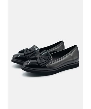 Complete your everyday look with these Juliette Kid's School Bow Front Loafer Shoes, designed for smart style and lasting comfort. Featuring a classic loafer silhouette with a statement bow detail, they add a polished finish to school uniforms while keeping practicality in mind. The cushioned insole and lightweight sole provide all-day comfort, making them perfect for long school days. Ideal for class, assemblies, and after-school activities. Key Features: • Material: Shiny black patent faux leather upper with soft lining • Design: Classic loafer style with bow front detail • Closure: Easy slip-on design for everyday wear
