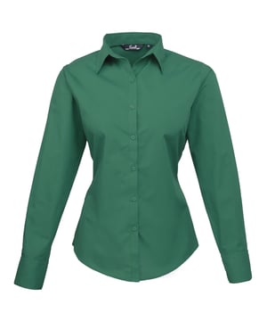 Womens easy care long sleeve blouse. Soft collar styling. Rounded bottom hem. Fitted styling with bust and back darts. Pearlised buttons on white shirt, self colour buttons on black. Double buttons on cuff. Size 6*, 8, 10, 12, 14, 16, 18, 20, 22, 24, 26 * size 6 only available in black and white. Bust: 6 - 35.5”, 8 - 37.5”, 10 - 39.5”, 12 - 41.5”, 14 - 43.5”, 16 - 45.5” 18 - 47.5”, 20 - 49.5”, 22 - 51.5”, 24 - 53.5”, 26 - 55.5”. Fabric 65% Polyester, 35% Cotton. Plain Poplin Weave Weight 105gsm