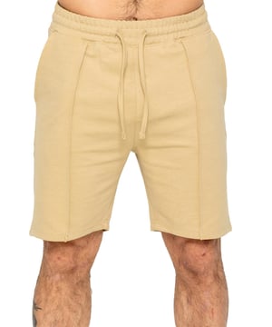 Enzo Mens Casual Stretch Shorts offer comfort and convenience with 2 side & 2 back pockets, elastic waistband & adjustable drawstring, and front pin tuck seam detail for added style and functionality. Perfect for errands or lounging with a practical and stylish design.