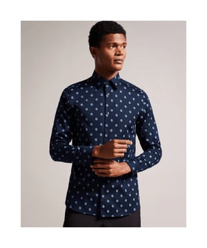 Bring the beauty of a flower garden to your wardrobe with our KYME button-up shirt. Made from a comfortable cotton blend, this long-sleeved shirt features a classic collar and a regular fit for a timeless look. Whether paired with jeans for a casual day out or tucked into dress pants for a more formal occasion, this shirt is sure to make a statement.
Button up shirt. Cotton blend. Painted floral print. Long sleeved. Classic collar. Slim fit.
97% Cotton, 3% Elastane.