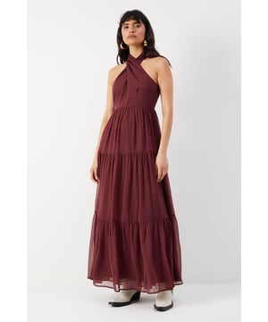 Introducing our stunning chiffon halter tier maxi sundress! This dress is perfect for any occasion, whether it's a summer wedding or a casual day out. The tiered skirt adds a touch of elegance and movement, while the halter neckline adds a trendy and flattering touch. Made from high-quality chiffon fabric, this dress is lightweight and comfortable to wear