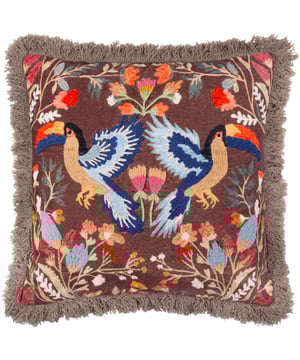 Add a touch of tropical elegance to your home with the Mirrored Toucan Embroidered Cushion. This exquisite piece features vibrant toucans and lush jungle foliage brought to life on luxurious 100% cotton velvet. The intricate embroidery, set against a mirrored design, captures the essence of nature's beauty, while the full fringe trim adds a stylish touch. Ideal for those who cherish print and pattern and have a keen interest in the natural world, this cushion is a maximalist’s dream—a perfect fusion of artistry and nature that transforms any space into a refined haven.