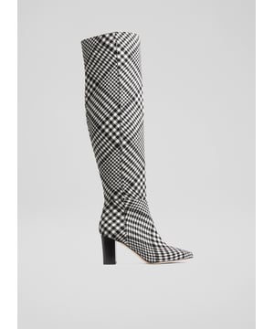 Every wardrobe needs a statement pair of boots, and our Courtney over-the-knee boots very much fit that bill. Crafted in Italy from a heritage, Sixties-inspired black and white Prince of Wales check fabric, they have an almond-shaped toe, a half zip to the inside, sit just over the knee with a great fit and have a stacked 75mm block heel. Wear them with jeans or tailored trousers tucked in, or with winter dresses and skirts that need a pop of print.