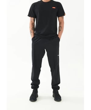 Relaxed fit, mid-rise jogging bottoms. Elasticated waistband with a P.E Nation external drawcord. Side pockets and a back pocket with zipper. P.E Nation stitched label on the front