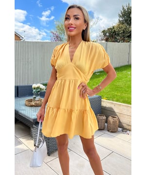Our Yellow Short Sleeve Tie Back V Neck Mini Dress is the perfect day dress! Featuring a v-neck, short sleeves, tie back and a smock style mini dress. We'll be pairing with sandals and a cute bag!  Model wears: UK 8/ EU 36/ US 4 Model's height: 165cm/ 5'5" Approx length from centre back to hem: 89cm Fabric composition: 100% Polyester Colour: YELLOW
