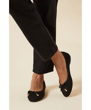 Charming bow detail adorns the toe
        Comfortable wide fit design
        Versatile flat heel (0-2cm)
        Faux leather construction
        Elegant round toe shape
    
    Step into effortless style with these delightful wide fit ballet pumps. The charming bow detail adds a touch of femininity, perfect for the fashion-conscious woman in her 30s. These versatile flats seamlessly transition from day to night, making them ideal for various occasions. Pair them with tailored trousers and a blouse for a polished office look, or dress them down with jeans and a casual top for weekend brunches with friends. The comfortable wide fit and flat heel ensure all-day wearability, whether you're attending a baby shower or rushing from desk to dinner. The faux leather material offers a sleek finish, while the round toe provides a classic silhouette. These ballet pumps are a wardrobe essential, offering both style and comfort for the modern woman who values practicality without compromising on trend-led fashion.