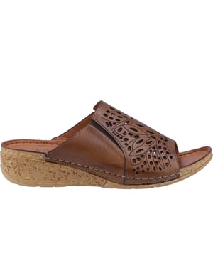 The Riva Cardigan Sandals offer a perfect blend of elegance and casual comfort. These open-toe wedge mules feature a refined leather upper with decorative cut-outs, adding a touch of sophistication to their design. The easy slip-on style ensures effortless wear, while the strap design provides a secure fit.
 Enjoy superior comfort with a lightly padded leather footbed and a lightweight bark-effect platform wedge heel that combines natural charm with modern style. Contrast stitching accents enhance these chic sandals, and the grippy outsole ensures stability with every step.
 - Leather upper 
 - Decorative cut out 
 - Easy slip on, open toe design 
 - Strap design 
 - Lightly padded leather foot bed
 - Contrast stitching accents
 - Bark/wood effect heel
 - Grippy outsole
