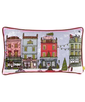 Inspired by traditional, heritage shops, the Christmas Spirit cushion is adorned with Christmas décor and snow. The design features visual delights such as a chocolate box-style street scene, decorated trees and a car overloaded with presents. For more festive fun, the reverse is made with a sumptuous velvet in Santa Claus red. The perfect addition for the seasonal period!