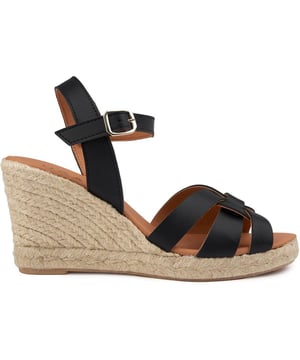Stap in de Vegan Rhubarb Wedge Espadrille van V.gan, de top van duurzame chic. Deze door Peta goedgekeurde, zwarte wedge-sandalen hebben een synthetisch ontwerp met amandelvormige neus en een comfortabele rubberen zool. Ethisch geproduceerd en verpakt in gerecycled materiaal, zijn ze een modieuze knipoog naar eco-bewustzijn.
